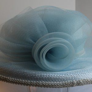 Stunning Baby Blue Hat With large bow and delicate flowers holding netting.